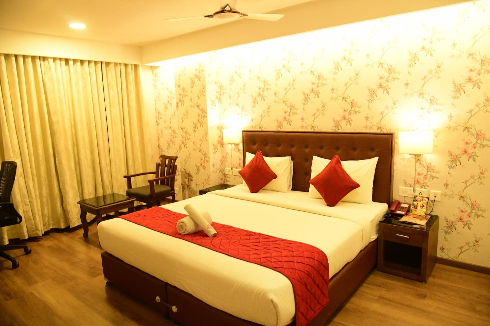 Spacious premium room interior at Thechi Hotel, Hosur